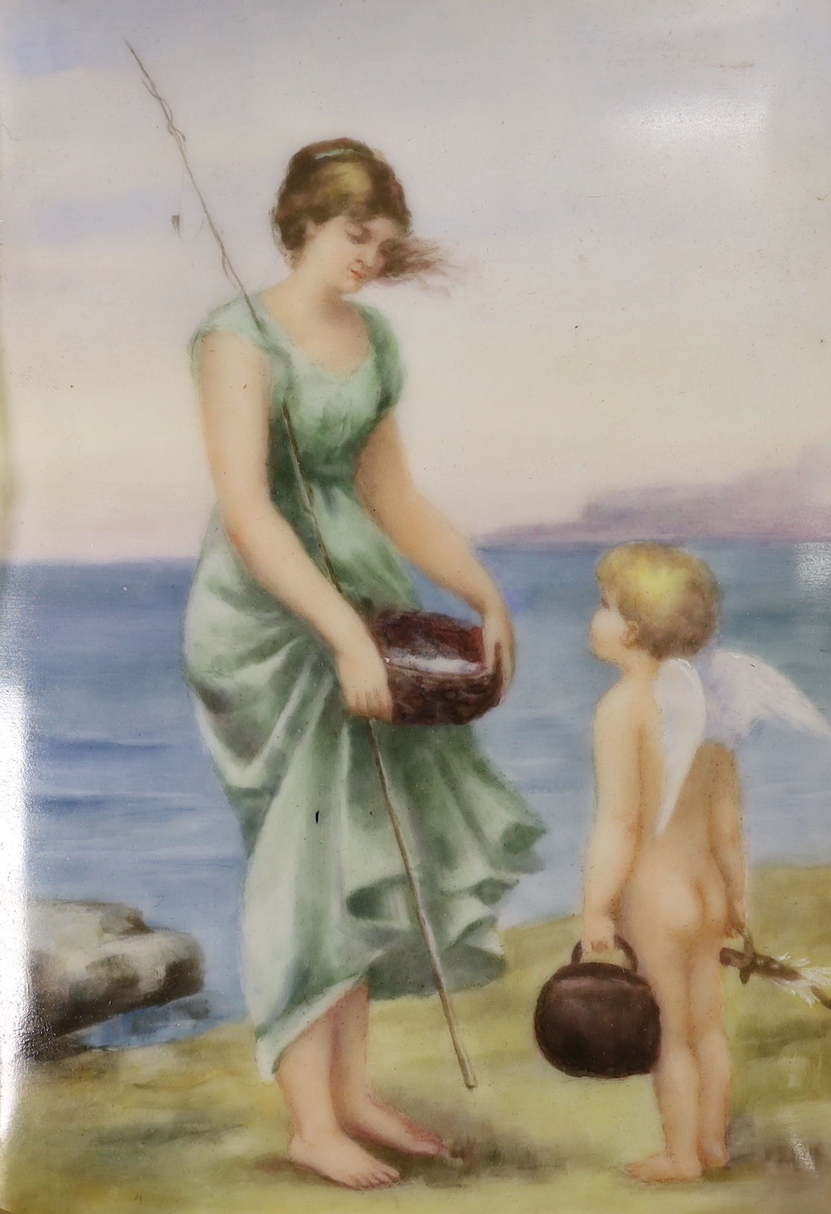 A Continental porcelain plaque painted with a woman and putti on a beach, 17 x 12cm